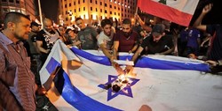 آتش‌زدن پرچم رژیم صهیونیستی در تظاهرات لبنان