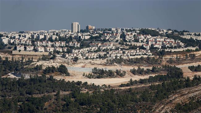 The picture taken on July 29, 2016 shows a general view of Israeli construction cranes and excavators at the building site of new settler units in the illegal settlement of Gilo in East Jerusalem al-Quds. ©AFP