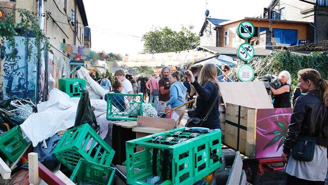 People are seen in the Freetown Christiania neighborhood of Copenhagen, Denmark, September 2, 2016. Police said a 25-year-old man died overnight from injuries he sustained during a shootout with police in the area
