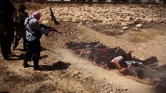 An image taken from a video posted by Daesh militants shows the terrorists executing captured Iraqi soldiers from Camp Speicher near Tikrit, northern Iraq, on June 12, 2014.