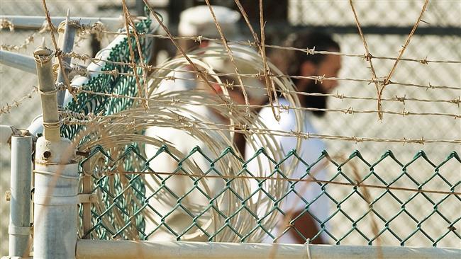 US military guards move a detainee to an undefined facility inside Camp Delta in the Guantanamo Bay prison. (AFP file photo)