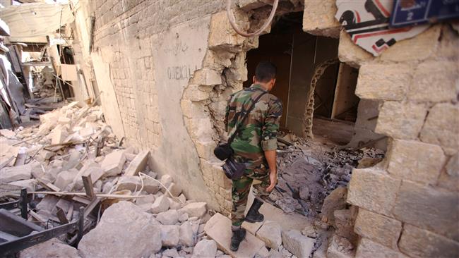 A Syrian government soldier walks in the damaged al-Farafira Souk in the government-held part of Aleppo, northwestern Syria, on September 16, 2016. (Photos by AFP)