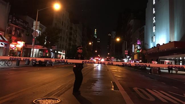 A police officer is seen at West 23rd and 8th Avenue, two blocks west of the explosion. (Reuters photo)