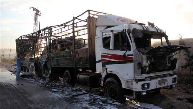 A damaged truck carrying aid is seen on the side of the road in the town of Urm al-Kubra on the western outskirts of the northern Syrian city of Aleppo, September 20, 2016. (Photo by AFP)