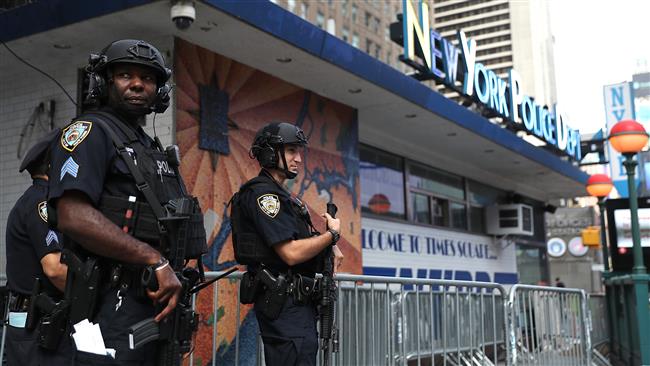 New York City police officers stand guard at Times Square on September 20, 2016 in New York City. (photo by AFP)