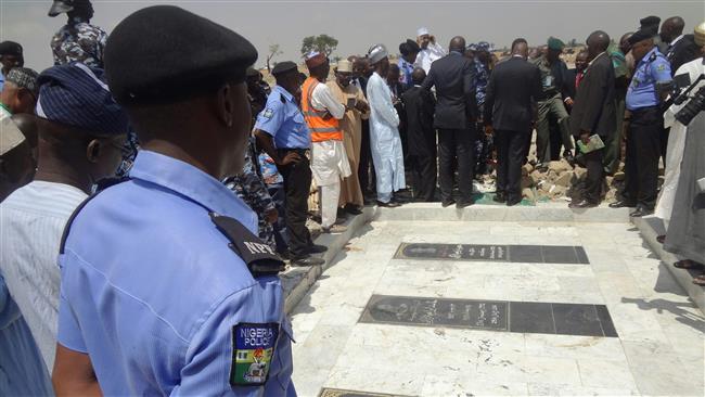 A picture taken on April 26, 2016 shows members of Kaduna state Judicial Commission of Inquiry standing at the demolished Islamic Movement in Nigeria (IMN) cemetery, on the outskirts of the northern Nigeria city of Zaria on April 26, 2016. (Photo by AFP)