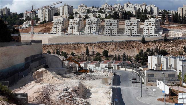 This picture taken on September 23, 2016 shows Israeli construction cranes and excavators at a building site of new housing units in the Israeli settlement of Neve Yaakov, in the northern area of East Jerusalem al-Quds. (Photo by AFP)