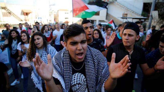 Palestinians living in the occupied territories march in Sakhnin on October 1, 2016 to mark the 16th anniversary of the Second Palestinian Intifada. (Photo by Reuters)