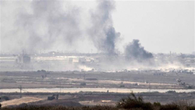 The picture shows smoke rising from the besieged Gaza Strip after an Israeli military strike on the coastal sliver on October 5, 2016. (Photos by AFP)