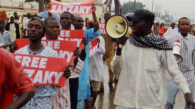 File photo taken in northern Nigerian city of Kano, on August 11, 2016 shows demonstrators from the Islamic Movement in Nigeria (IMN) chanting slogans and demanding the release of prominent cleric Sheikh Ibrahim Zakzaky who has been in detention without charge or trial since late 2015. (Photo by AFP)