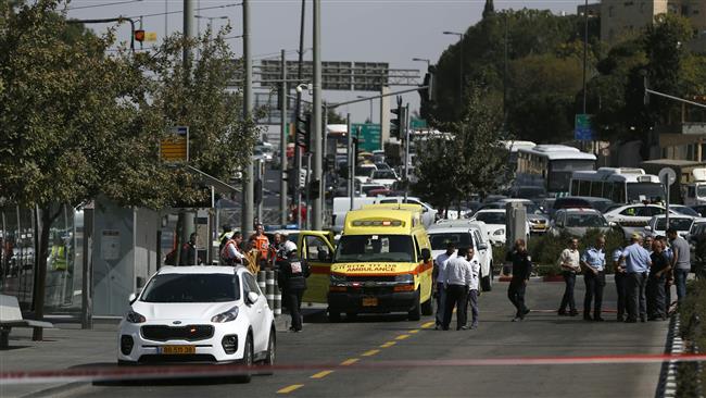 Israeli forces cordon off the site of a shooting attack near Israeli police headquarters in Jerusalem al-Quds on October 9, 2016. (Photo by AFP)