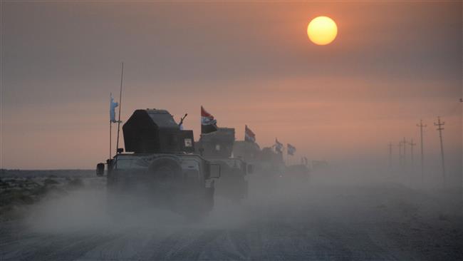 Iraqi government forces drive in military vehicles in Salahuddin province on October 10, 2016, as they clear the area in preparation for the push to retake the northern Iraqi city of Mosul. (Photos by AFP)