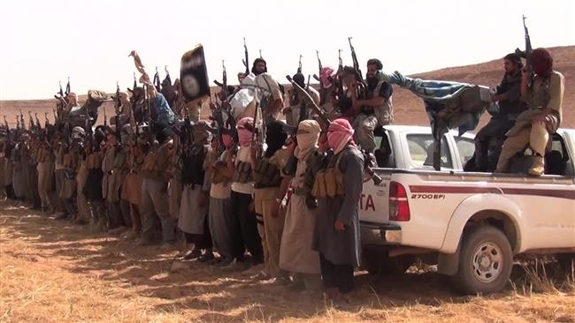 This file photo shows Takfiri Daesh terrorists in an unknown location in Iraq.