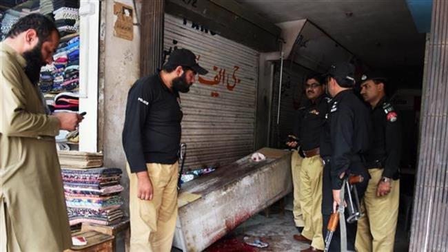 Pakistani police are seen at the site of a shooting attack against the Hazara Shia community in a market in southwestern city of Quetta, May 27, 2015. (Photo by AFP)