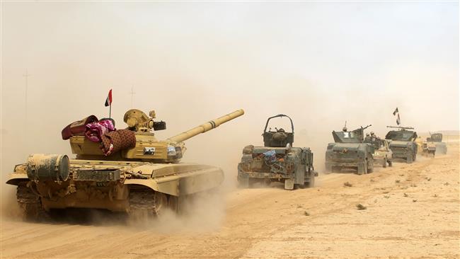 Iraqi forces deploy on October 17, 2016 in the area of al-Shurah, some 45 km south of Mosul, as they advance towards the city to retake it from Daesh terrorists. (Photo by AFP)