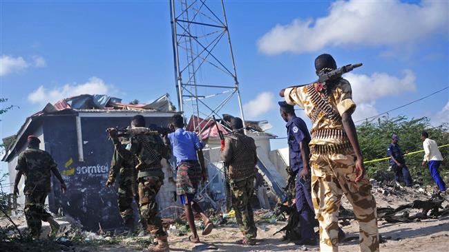 Members of the Somali military walk at the site of a car bomb attack near Mogadishu, September 18, 2016. (Photo by AFP)