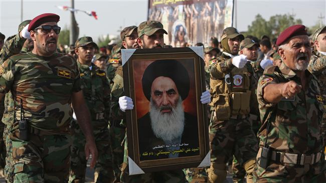 Fighters from pro-government Popular Mobilization Units carry a picture of prominent Shia cleric Grand Ayatollah Ali al-Sistani during a parade in Basra, Iraq, on September 26, 2015. (Photo by AP)