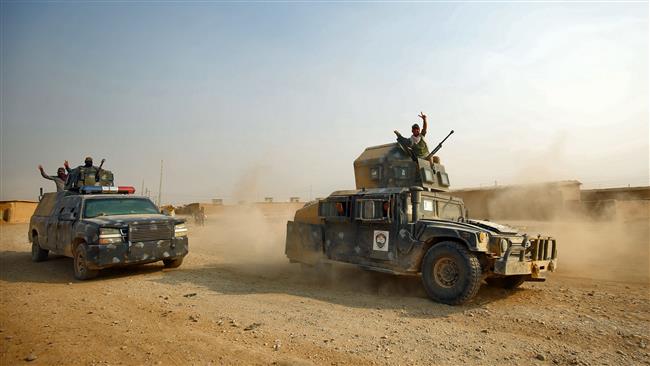 Iraqi forces enter the village of al-Khuwayn south of Mosul, after recapturing it from Daesh on October 23, 2016, in part of an ongoing operation to tighten the noose around Mosul and reclaim the last major Iraqi city under Daesh control.