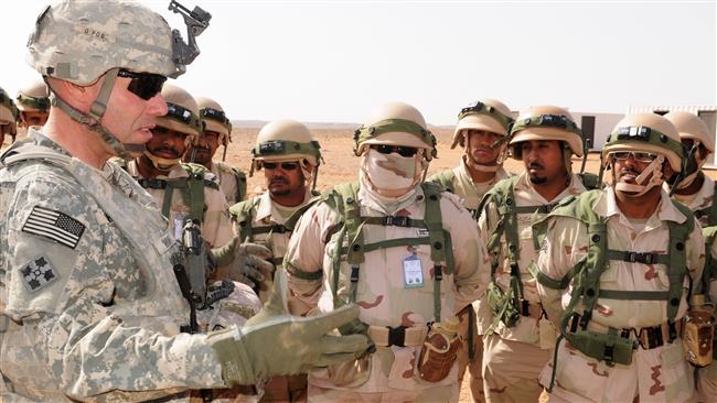 A US military officer speaking to a group of Saudi servicemen.