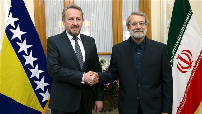 Iranian Parliament Speaker Ali Larijani (R) shakes hands with the chairman of the Presidency of Bosnia and Herzegovina, Bakir Izetbegovic, in Tehran on October 25, 2016. (Photo by IRNA)