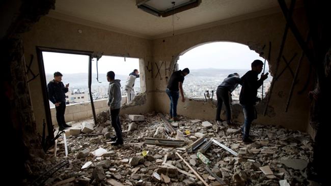 Palestinians inspect the damaged house of Zaid Amer, after it was demolished by the Israeli army, in the West Bank city of Nablus, May 3, 2016. (Photo by AP)