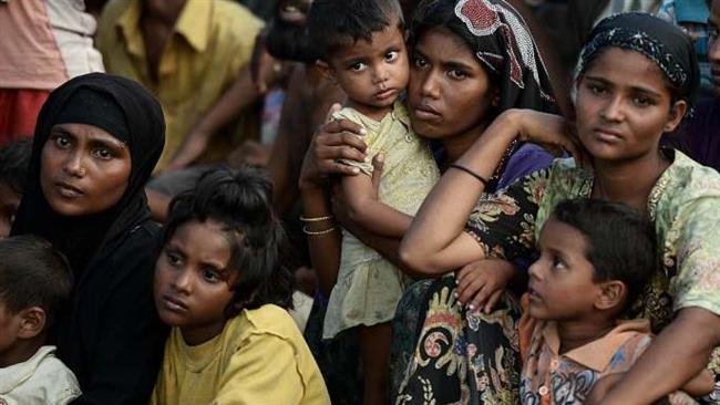 This file image shows Rohingya Muslims fleeing violence on a boat drifting in Thai waters off the southern island of Koh Lipe in the Andaman Sea, May 14, 2015. (Photo by AFP)
