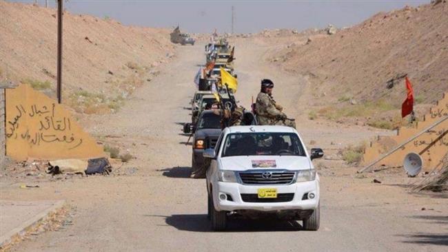 Volunteer fighters from Hashd al-Shaabi, also known as the Popular Mobilization Units, arrive in preparation for an operation to retake Mosul.