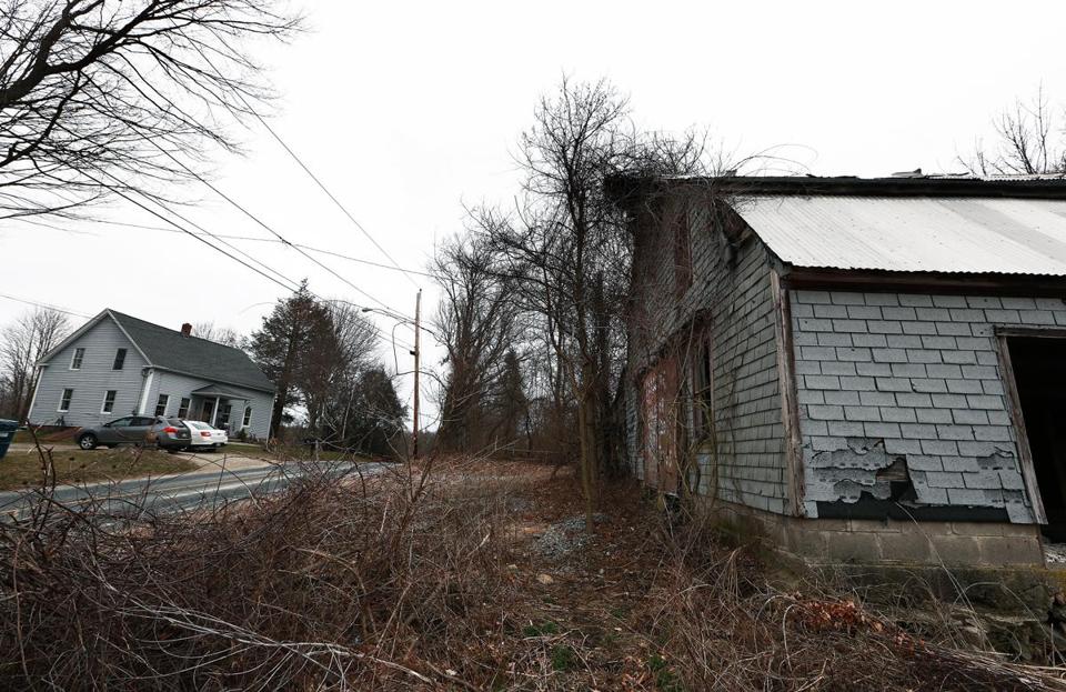 An old building (right) on the site where the Islamic Society of Worcester wants to build a cemetery.