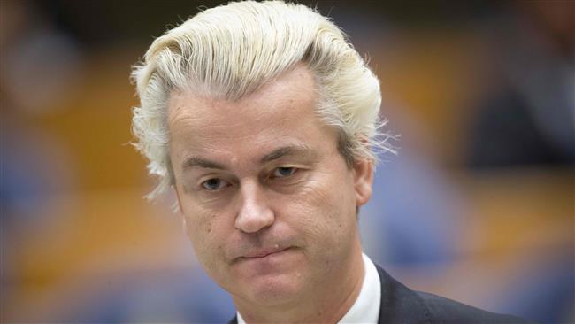 This file photo, taken on December 18, 2014, shows Dutch far-right politician Geert Wilders standing at the Parliament building in The Hague. (By AFP)