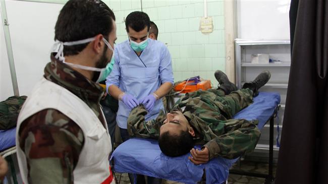 A Syrian man is treated at a hospital in a government-held area of Aleppo on October 31, 2016 following reports saying that militants had fired shells containing toxic gas into government-controlled parts of the northern embattled city. (AFP photo)