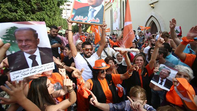 This image, taken in the southern suburbs of Beirut on October 31, 2016, shows people celebrating the election of Michel Aoun as the new president of Lebanon.