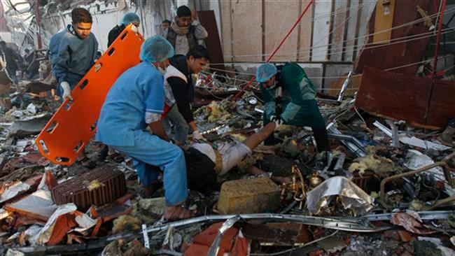 Yemeni rescue workers pull out a victim from amid the rubble following a Saudi airstrike against a packed funeral site in the capital, Sana’a, on October 8, 2016. (Photo by AFP)