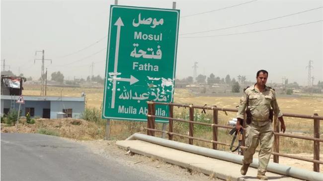 An Iraqi soldier is seen outside Mosul. (Photo by AFP)
