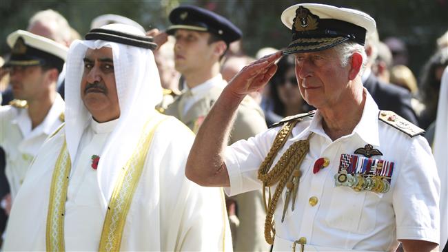 Britain’s Prince Charles salutes as Bahrain’s Foreign Minister Khalid bin Ahmed Al Khalifa stands nearby during a ceremony in Manama, Bahrain, November 11, 2016. (Photo by AP)