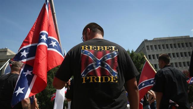 Ku Klux Klan members take part in a demonstration at the state house building on July 18, 2015 in Columbia, South Carolina. (Photo by AFP)