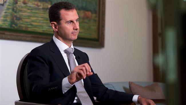 A file photo of Syrian President Bashar al-Assad speaking during an interview (Photo by AFP)