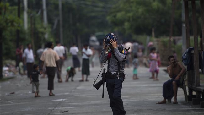 A Myanmar police officer stands guard at the Aung Mingalar ward, a confinement area for the persecuted Rohingya Muslim minority in Sittwe, the capital of Rakhine state, October 13, 2016. (Photo by AFP)