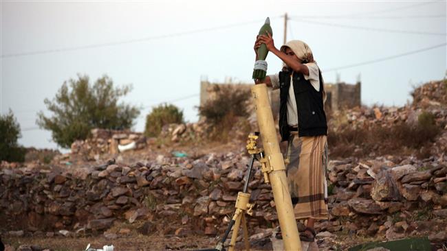 A militant, supporting forces loyal to the former Saudi-backed Yemeni government, places a mortar shell into a rocket launcher in Ta’izz, on November 1, 2016. (Photo by AFP)