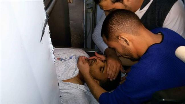 Relatives of slain Palestinian protester Mohammad Saeed Abu Sa’ada mourn at a morgue in Gaza City, Gaza Strip, on November 18, 2016.