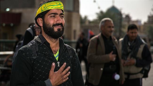 An Iranian pilgrim is seen overwhelmed with emotion upon reaching Imam Hossein’s holy