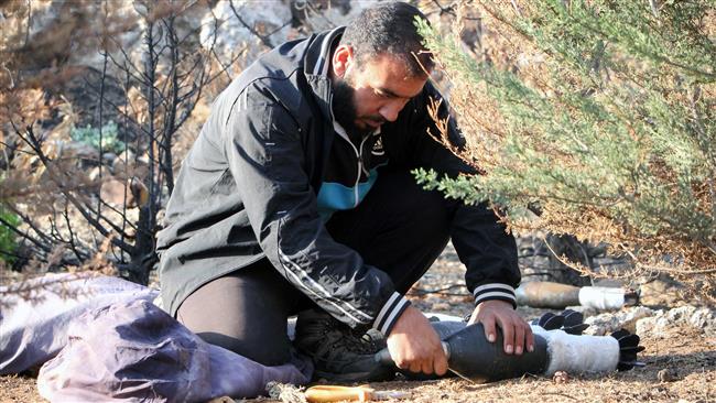 A Syrian militant prepares mortar shells for attacks on government-controlled western Aleppo, Syria, October 30, 2016. (Photos by AFP)