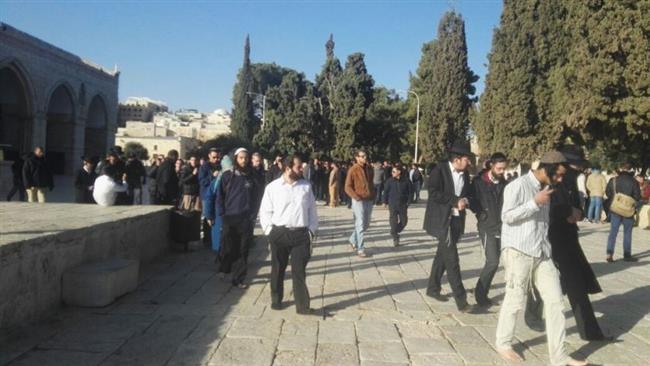 This photo provided by the Arabic-language Safa news agency shows Israeli settlers at the al-Aqsa Mosque compound in Jerusalem al-Quds on November 27, 2016.