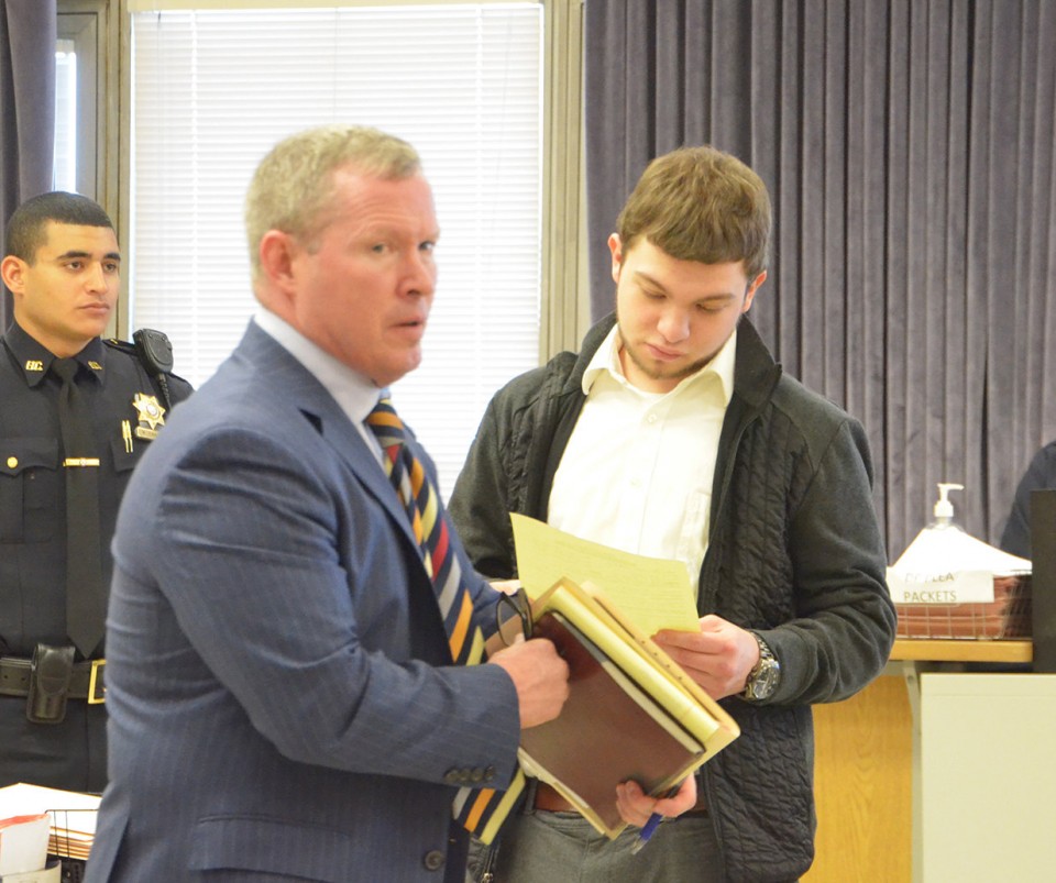 Jonathon Hussey, 20, (on right) pleaded guilty to criminal mischief in Jersey City today, Dec. 1, 2016, for spray-painting anti-Muslim graffiti on a Muslim community center in Bayonne in October. On left is attorney Daniel Welsh.