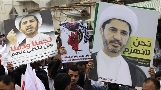 Bahrainis hold anti-government protest carrying posters of prominent Shia opposition cleric Sheikh Ali Salman in the country’s south, April 1, 2016. (Photo by AP)
