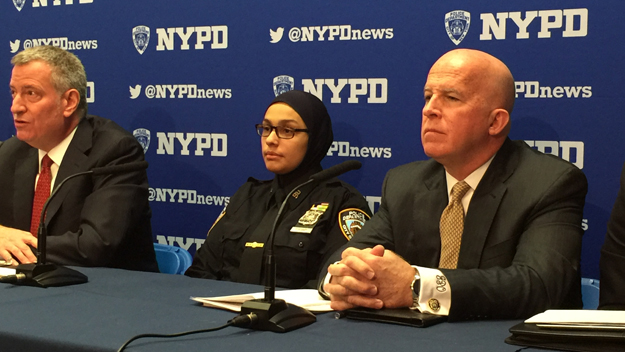 (From left to right) Mayor Bill de Blasio, Officer Aml Elsokary and Police Commissioner James O