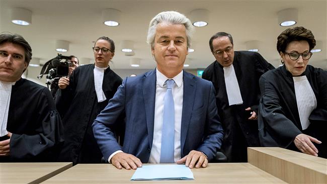This file photo taken on November 23, 2016, at the court of Schiphol, shows Geert Wilders (C) of the Party for Freedom (PVV) sitting upon arrival on the last day of his trial. (Photo by AFP)