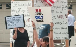 Debbie Rosi leads an August 2015 protest of a planned mosque on 15 Mile in Sterling Heights.