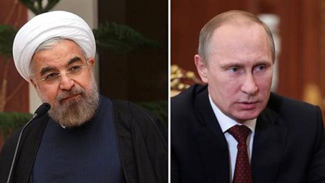 Iranian President Hassan Rouhani (L) and his Russian counterpart Vladimir Putin