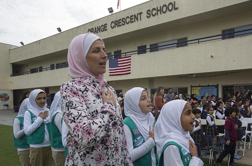Students at Orange Crescent School assemble to present a response to hate mail sent to area mosques by an anonymous individual. (Credit: David McNew / Los Angeles Times)
