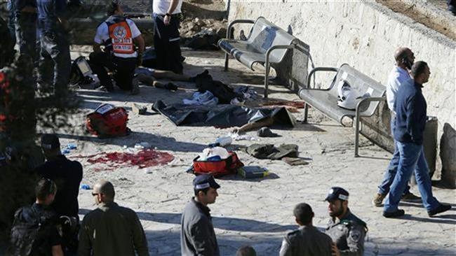 Israeli police officers and emergency personnel inspect the bodies of two Palestinians killed following an alleged attack at Damascus Gate, a main entrance to the Old City of East Jerusalem al-Quds on February 3, 2016.